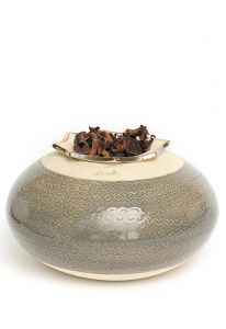 Ceramic funeral urn with silver heart