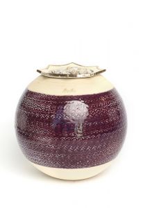 Ceramic funeral urn with silver heart